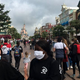 Guests in face masks visiting Disneyland Paris in June 2020.